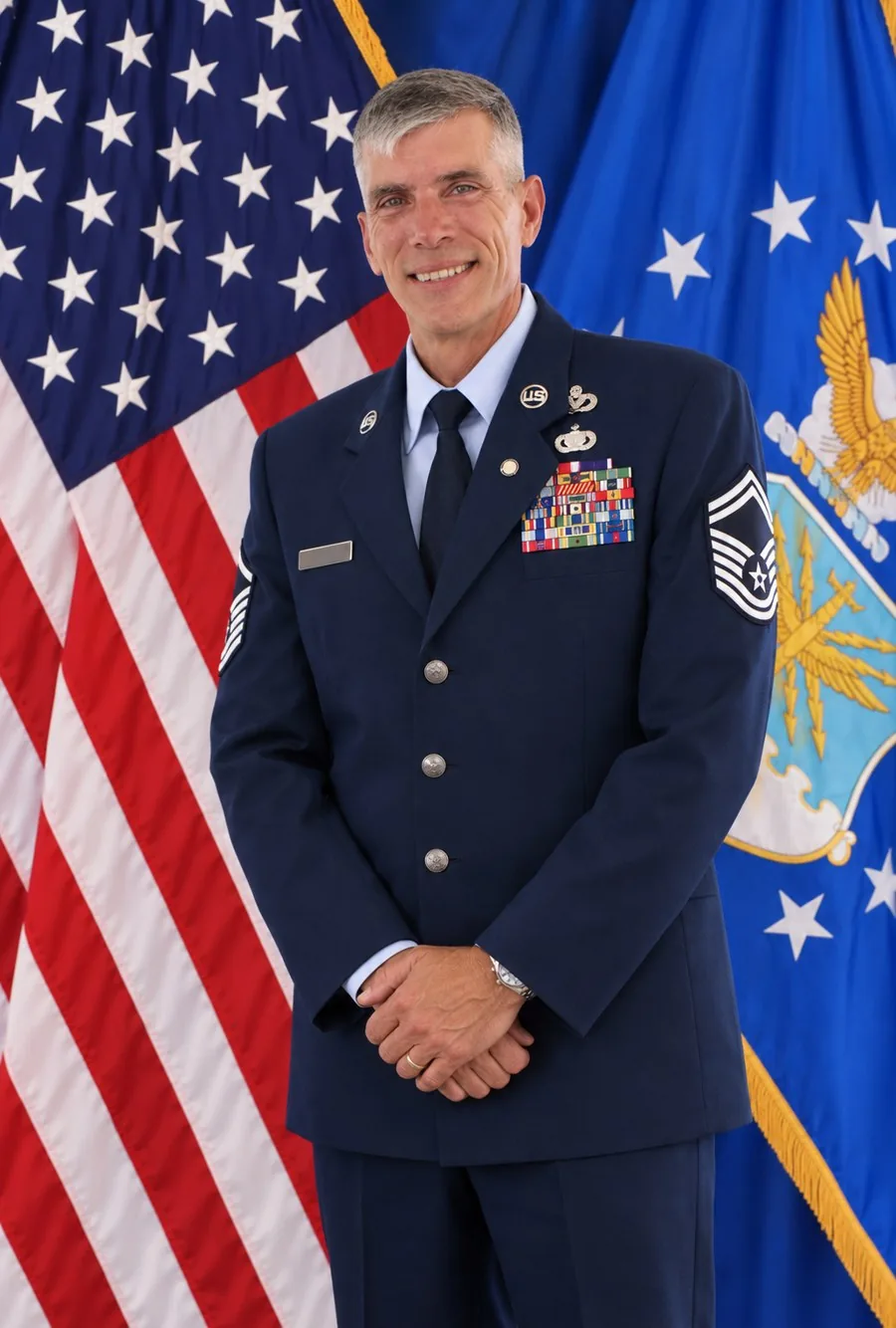 Ricky L. Willis in U.S. Air Force service dress before the American and Air Force flags